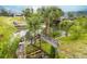 A tranquil waterfront view featuring lush vegetation and weathered stairs leading to the canal at 113 Douglas St, Edgewater, FL 32141