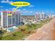 Seawinds #902 exterior view showcasing oceanfront access, a pool and coastal charm at 1183 Ocean Shore Blvd # 902, Ormond Beach, FL 32176