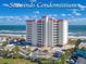 Seawinds Condominium complex with ocean views, lush landscaping, and convenient parking at 1183 Ocean Shore Blvd # 902, Ormond Beach, FL 32176