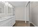 Bright bathroom with double sink vanity, large mirror, and closet at 1227 Wayne Ave, New Smyrna Beach, FL 32168