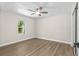 Cozy bedroom with wood floors, ample natural light, and ceiling fan at 1227 Wayne Ave, New Smyrna Beach, FL 32168