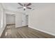 Bedroom with wood floors, large closet, and fan at 1227 Wayne Ave, New Smyrna Beach, FL 32168