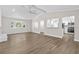 Bright, open-concept living space linking the kitchen and living areas with vaulted ceilings at 1227 Wayne Ave, New Smyrna Beach, FL 32168