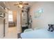 Functional storage area with small table, attic ceiling, and view into bonus room at 1910 Botree Ct, Port Orange, FL 32128