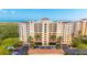 Beautiful condominium with private balconies, lush landscaping, and ample parking for residents and guests at 261 Minorca Beach Way # 406, New Smyrna Beach, FL 32169