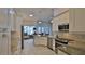 Gourmet kitchen with stainless steel appliances, white cabinetry, and granite countertops at 2904 Palma Ln, New Smyrna Beach, FL 32168
