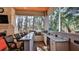 Fully equipped outdoor kitchen with a built-in grill, sink, and bar seating at 2904 Palma Ln, New Smyrna Beach, FL 32168