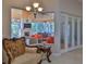 Charming patio view featuring a fireplace, TV, and a glimpse of outdoor kitchen area at 2904 Palma Ln, New Smyrna Beach, FL 32168