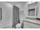 Well-lit bathroom features a shower-tub combo, granite countertop, and neutral decor at 2921 India Palm Dr, Edgewater, FL 32141