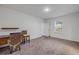 Spacious carpeted bedroom with a desk and natural light from the window at 2921 India Palm Dr, Edgewater, FL 32141