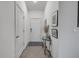 Inviting entryway with a stylish table, decorative items, and neutral tile flooring at 2921 India Palm Dr, Edgewater, FL 32141