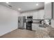 Updated kitchen featuring granite counters, stainless steel appliances, tile flooring and white cabinetry at 2921 India Palm Dr, Edgewater, FL 32141