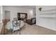 Open living room with a dining area, tile floors, a dark brown recliner, and built-in shelving for storage and decor at 2921 India Palm Dr, Edgewater, FL 32141