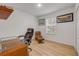 Office space with hardwood floors, chair, desk, and a window offering natural light for a comfortable work environment at 2921 India Palm Dr, Edgewater, FL 32141