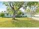 Charming single-Gathering home featuring a well-manicured lawn and mature trees at 3 Castle Manor Dr, Ormond Beach, FL 32174