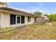 Backyard with a screen door and tile roof at 3522 Forest Branch Dr # B, Port Orange, FL 32129