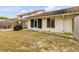 Backyard with screen door, covered grill, and tile roof at 3522 Forest Branch Dr # B, Port Orange, FL 32129
