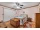Cozy bedroom featuring ceiling fan, wood floors and natural light at 3522 Forest Branch Dr # B, Port Orange, FL 32129
