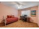 Bedroom features a ceiling fan, hardwood floors, and natural light at 3522 Forest Branch Dr # B, Port Orange, FL 32129
