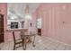 A bright dining area featuring tile floors and seamless view into the kitchen and living areas at 3522 Forest Branch Dr # B, Port Orange, FL 32129
