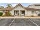 Charming condo with a terracotta roof, front patio, and freshly manicured landscaping at 3522 Forest Branch Dr # B, Port Orange, FL 32129