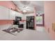 This well-lit kitchen is equipped with white cabinets and modern appliances at 3522 Forest Branch Dr # B, Port Orange, FL 32129
