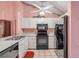 Bright kitchen boasts white cabinets and modern black appliances at 3522 Forest Branch Dr # B, Port Orange, FL 32129
