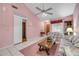 A bright living room featuring tile flooring, a ceiling fan, and a comfortable seating arrangement at 3522 Forest Branch Dr # B, Port Orange, FL 32129