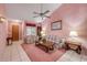 A spacious living room with tile floors, comfortable seating, and neutral pink walls at 3522 Forest Branch Dr # B, Port Orange, FL 32129