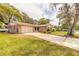 Inviting single story home featuring a spacious driveway and attached two-car garage at 3635 Scott St, Port Orange, FL 32129
