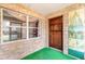Charming front porch featuring stone accents, a wood door, and a bright, inviting entryway at 3635 Scott St, Port Orange, FL 32129