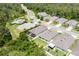 Aerial view of the backyard and house, highlighting the outdoor living space and proximity to community amenities at 532 White Coral Ln, New Smyrna Beach, FL 32168