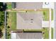Aerial view of a single Gathering home showing the roof, fenced backyard, and landscaping at 532 White Coral Ln, New Smyrna Beach, FL 32168