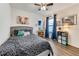Bedroom with a gray headboard, blue accents, decor, and a storage cube at 532 White Coral Ln, New Smyrna Beach, FL 32168