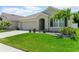 Charming single-story home featuring a two car garage, well-maintained lawn, and inviting front entrance at 532 White Coral Ln, New Smyrna Beach, FL 32168