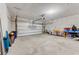 Spacious garage with block walls and concrete flooring offering ample storage or parking at 532 White Coral Ln, New Smyrna Beach, FL 32168