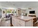 Island kitchen flows into dining and Gathering room areas at 532 White Coral Ln, New Smyrna Beach, FL 32168