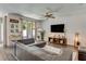 Spacious living room with hardwood floors, ceiling fan, and neutral décor at 532 White Coral Ln, New Smyrna Beach, FL 32168