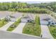 A peaceful neighborhood featuring single-Gathering homes with well-maintained lawns and landscaping from an aerial view at 1012 Bradford Ridge Dr, Leesburg, FL 34748