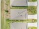 An aerial top-down view of houses with neat lawns and landscaping, showcasing the uniformity of the neighborhood at 1012 Bradford Ridge Dr, Leesburg, FL 34748