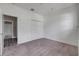 A secondary bedroom with carpet, closet space, and access to an adjacent room at 1012 Bradford Ridge Dr, Leesburg, FL 34748