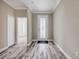 Elegant entryway featuring wood-look tile flooring, decorative front door, and neutral wall paint at 1012 Bradford Ridge Dr, Leesburg, FL 34748