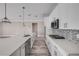 Modern kitchen featuring stainless steel appliances, white cabinets, and mosaic backsplash on the countertops at 1012 Bradford Ridge Dr, Leesburg, FL 34748