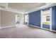 A spacious main bedroom with trey ceilings, neutral carpet, and generous natural light from multiple windows at 1012 Bradford Ridge Dr, Leesburg, FL 34748