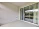 Enclosed patio with views of the lush backyard at 1012 Bradford Ridge Dr, Leesburg, FL 34748