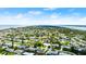 Panoramic aerial view of a quiet neighborhood, showcasing the ocean in the distance at 121 Ellicott Dr, Ormond Beach, FL 32176