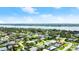 Aerial view of a charming neighborhood featuring the home near a waterfront with beautiful landscaping at 121 Ellicott Dr, Ormond Beach, FL 32176