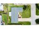 Overhead shot of home with green lawn and neutral paint at 121 Ellicott Dr, Ormond Beach, FL 32176
