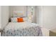 Bright bedroom featuring a cozy bed and a nautical theme with vibrant colors at 121 Ellicott Dr, Ormond Beach, FL 32176