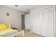 Neutral bedroom featuring a closet, an open doorway, and bright sunlight at 121 Ellicott Dr, Ormond Beach, FL 32176